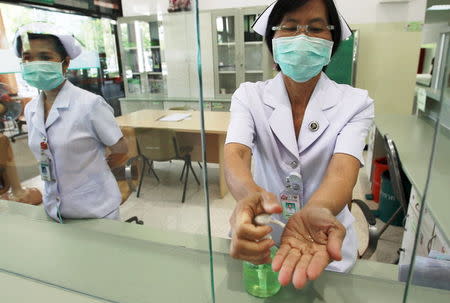 A nurse sanitizers her hands to prevent contracting Middle East Respiratory Syndrome (MERS) at the Bamrasnaradura Infectious Diseases Institute in Nonthaburi province, on the outskirts of Bangkok, Thailand, June 19, 2015. REUTERS/Chaiwat Subprasom