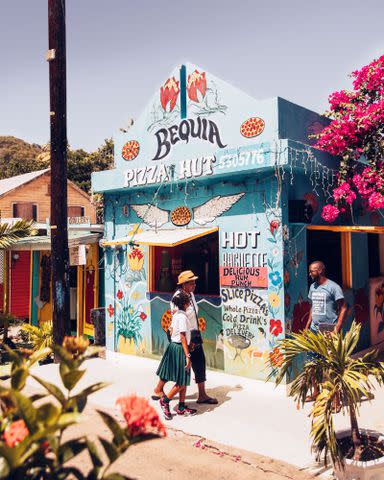 <p>JÃ©rÃ´me Galland</p> The islandâ€™s local â€œPizza Hutâ€ (not affiliated with the franchise) offers pizza in a Caribbean-style setting