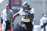 New York Jets running back Josh Adams (36) runs a drill during practice at the team's NFL football training facility, Saturday, July. 31, 2021, in Florham Park, N.J. (AP Photo/Rich Schultz)