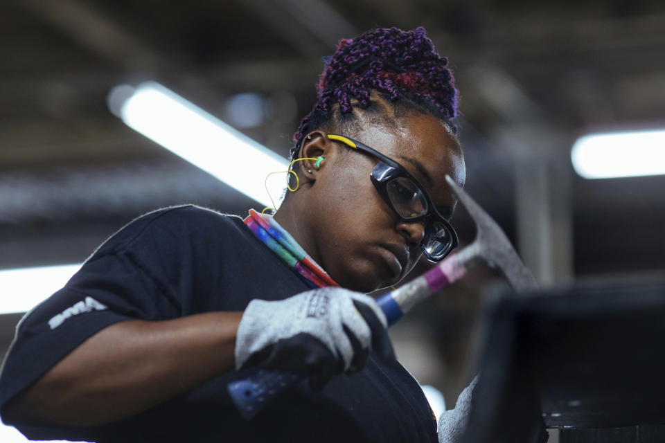 Sheet metal worker Carey Mercer assembles ductwork at Contractors Sheet Metal on Tuesday, Aug. 3, 2021, in New York. The construction industry is fighting to recruit more women into a sector that faces chronic labor shortages. Women make up only 4% of skilled construction laborers in the U.S. and often face discrimination on jobs sites. (AP Photo/Kevin Hagen)