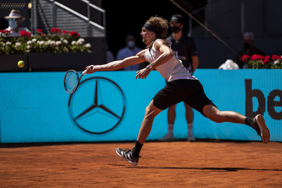 Germany's Alexander Zverev returns the ball to Spain's Rafael Nadal during their match at the Mutua Madrid Open tennis tournament in Madrid, Spain, Friday, May 7, 2021. (AP Photo/Bernat Armangue)