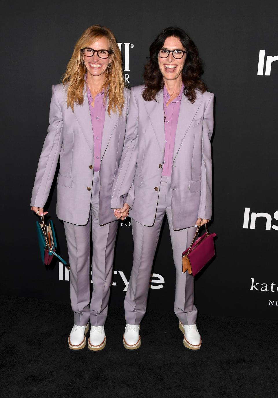 <p>The Hollywood actress and her stylist rocked up at the awards wearing matching lavender trouser suits – and shoes. <em>[Photo: Getty]</em> </p>