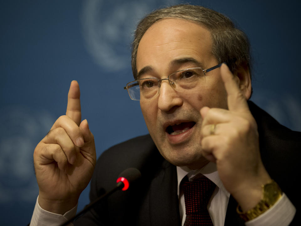 Syrian Deputy Foreign Minister Faisal Makdad gestures during a press briefing at the United Nations headquarters in Geneva, Switzerland, Sunday, Jan. 26, 2014. Syrians on opposite sides of their country’s civil war tried again Sunday to find common ground, with peace talks focusing on an aid convoy to a besieged city that once more came under mortar attack from the government. (AP Photo/Anja Niedringhaus)