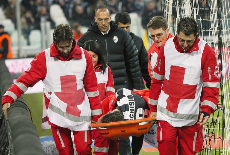 Juventus' Claudio Marchisio is carried off the playing field by medical staff after being injured during their Italian Serie A match against Sampdoria, at the Juventus Stadium in Turin, on January 6, 2013