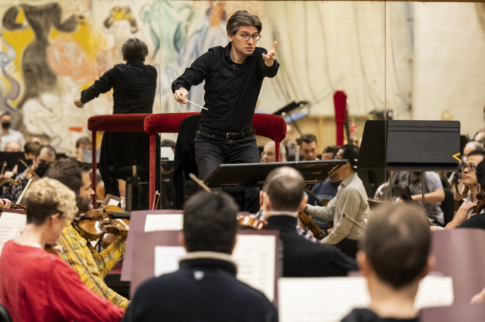 This image released by the Metropolitan Opera shows Daniele Rustioni conducting the Metropolitan Opera Orchestra during a rehearsal on Feb. 9, 2023 in New York. (Jonathan Tichler/Metropolitan Opera via AP)