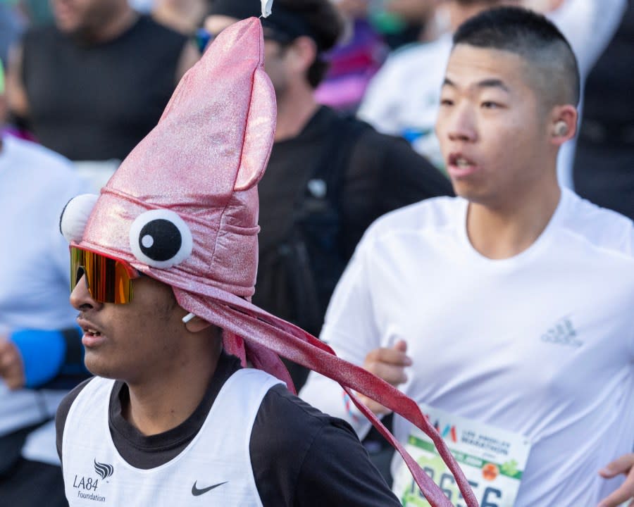 LOS ANGELES, CA MARCH 17: A runner sports interesting headgear during the LA Marathon on Sunday, March 17, 2024. Over 25,000 runners competed this year. (Myung J. Chun / Los Angeles Times via Getty Images)