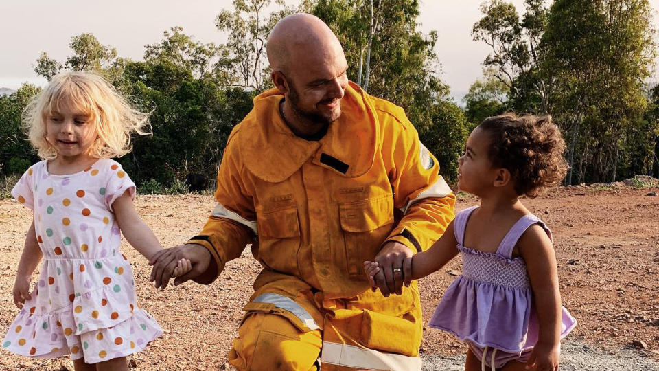 Rural firefighter Temil Ludwig being welcomed home by his two daughters. 