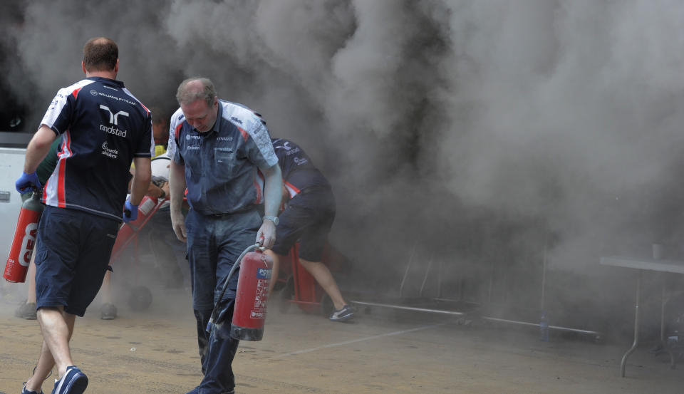 Racing team crews try to extinguish a fire in the Williams racing pit stand at the Circuit de Catalunya on May , 2012 in Montmelo on the outskirts of Barcelona after the Spanish Formula One Grand Prix. AFP PHOTO / JOSEP LAGOJOSEP LAGO/AFP/GettyImages