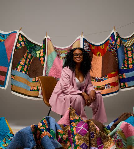 <p>Trokon</p> Tatyana Ali with Baby Yams quilts