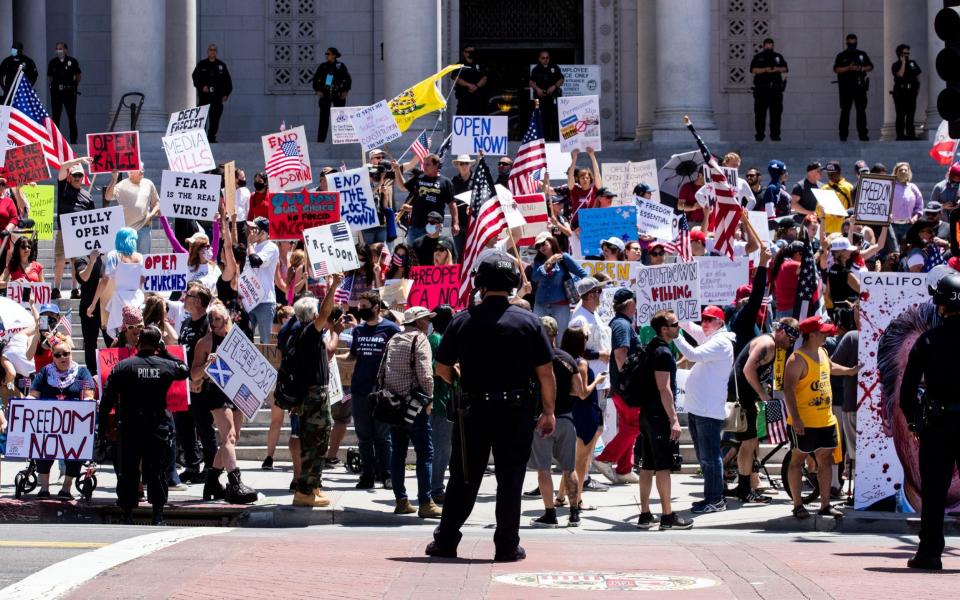 People protest during a reopen California demonstration in Los Angeles - ETIENNE LAURENT/EPA-EFE/Shutterstock