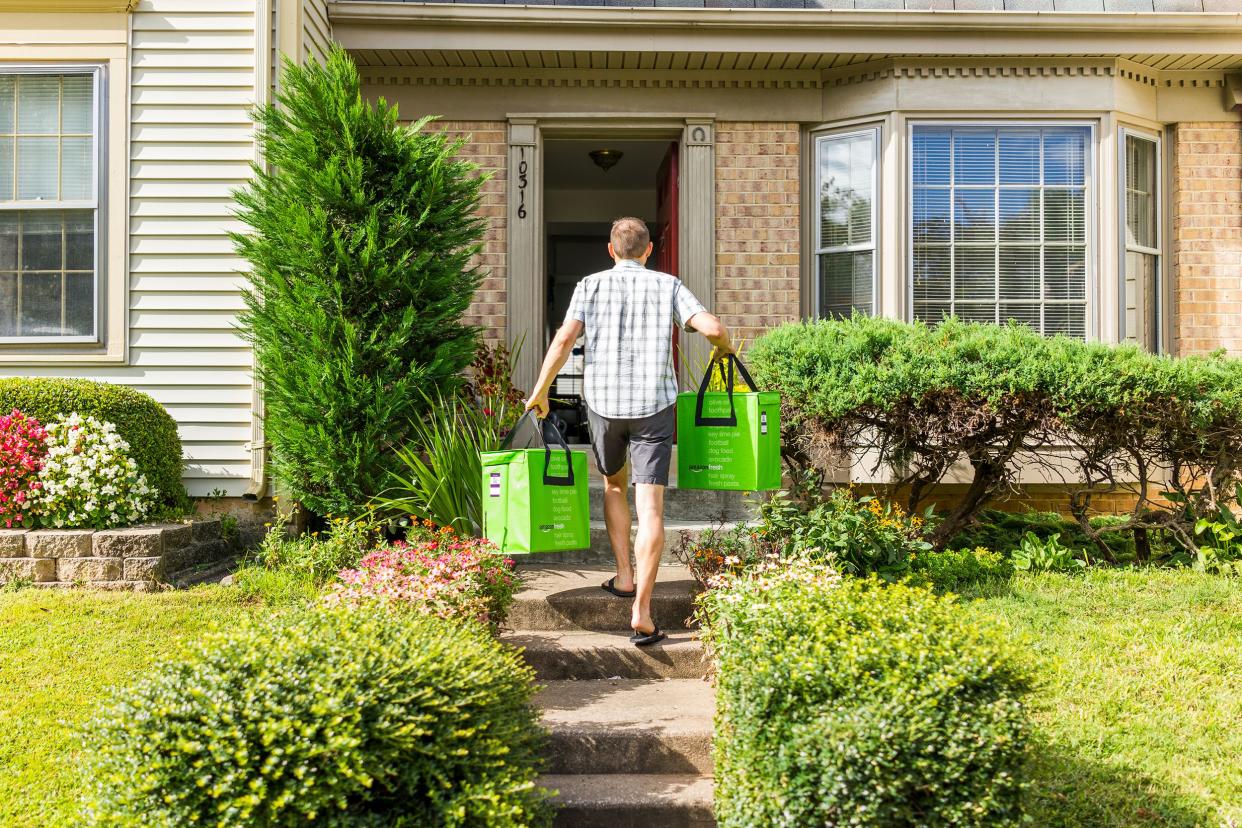 Amazon Fresh insulated grocery delivery bags totes man carrying to front door