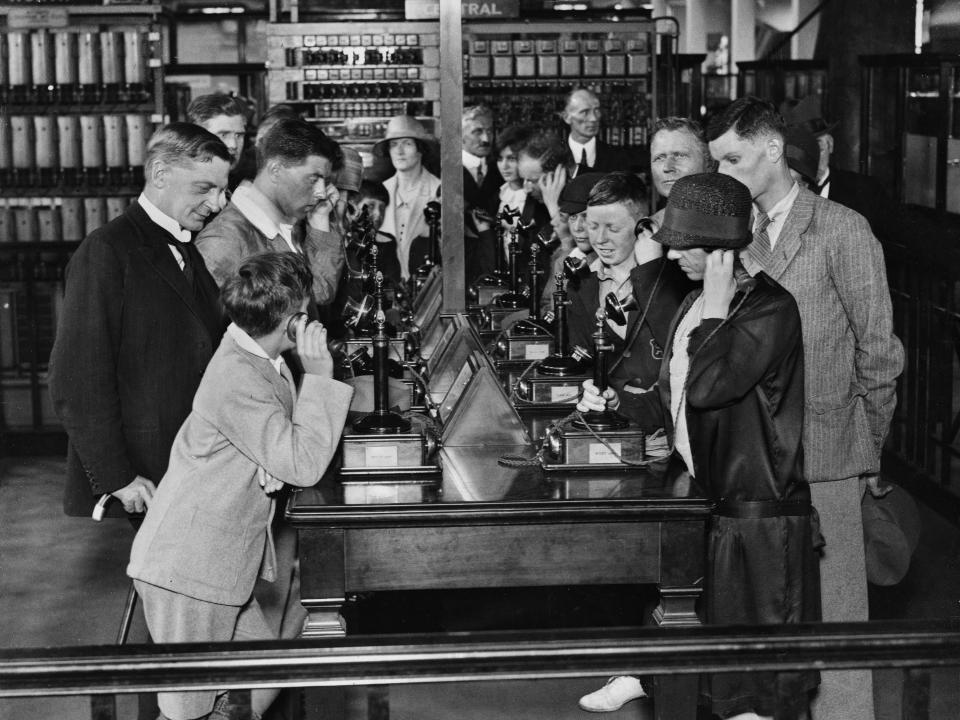 Visitors putting calls through as they learn how to use the automatic telephone during a class at the Science Museum in South Kensington, London, England, 2nd September 1929.