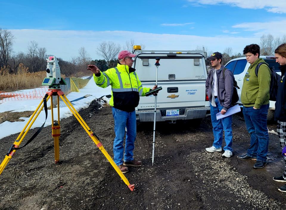 Local high school students get a breakdown of survey work utilized in planning the Black River Canal bridge on Thursday, March 16, 2023, between Port Huron Northern High School and Holland Woods Middle School.