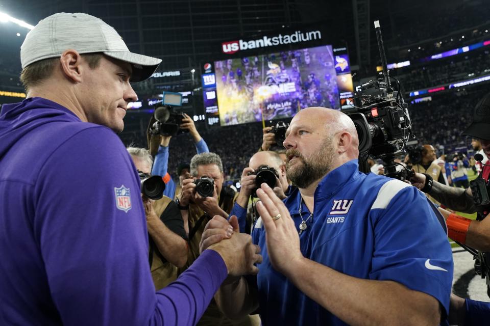 Minnesota Vikings head coach Kevin O'Connell talks to Minnesota Vikings head coach Kevin O'Connell after an NFL wild card football game Sunday, Jan. 15, 2023, in Minneapolis. The Giants won 31-24. (AP Photo/Abbie Parr)