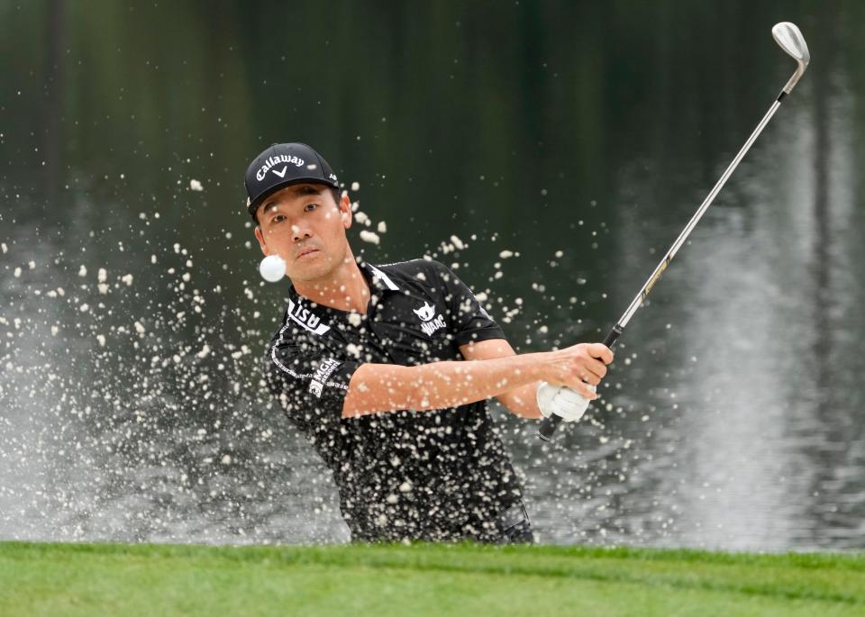 Kevin Na hits out of a bunker during the Par 3 Contest at the 2022 Masters.