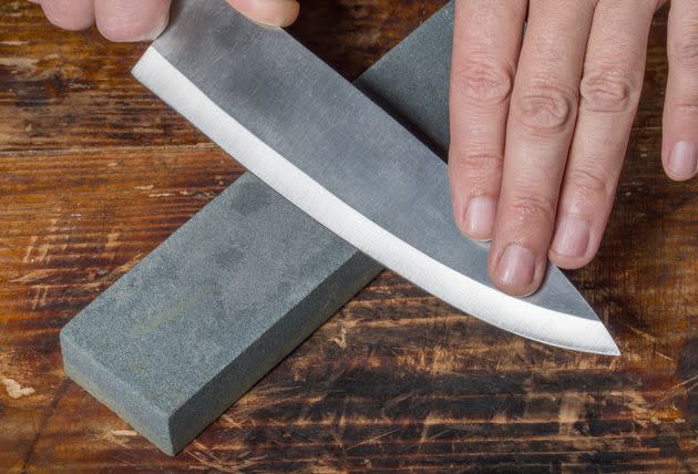 A whetstone is the ideal tool for sharpening the blade of a chef's knife. (Photo: A_Pobedimskiy via Getty Images)