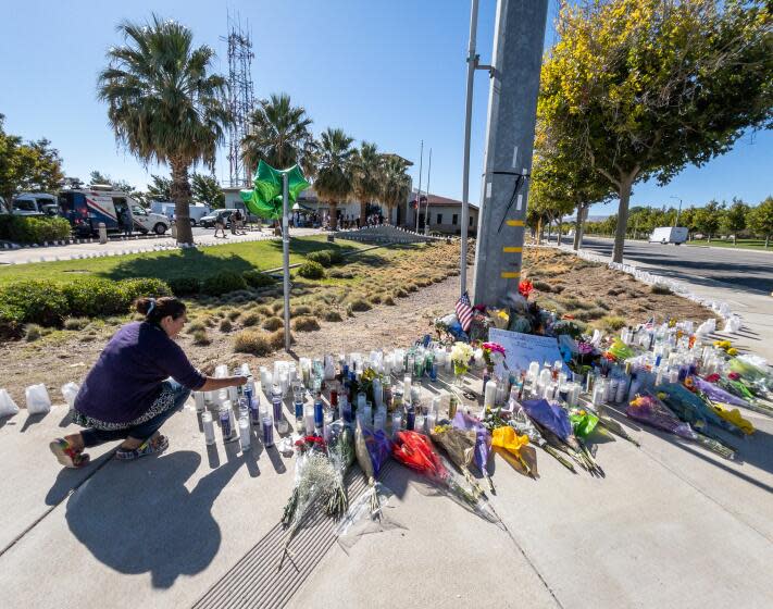 PALMDALE, CA - SEPTEMBER 18: A sidewalk memorial grows at the corner of Sierra Highway and Avenue Q in front of the Palmdale Sheriff's Station for Dep. Ryan Clinkunbroomer who was shot to death near the spot on Saturday evening. Sheriff Robert Luna announced the arrest of a suspect on Monday, Sept. 18, 2023. (Myung J. Chun / Los Angeles Times)