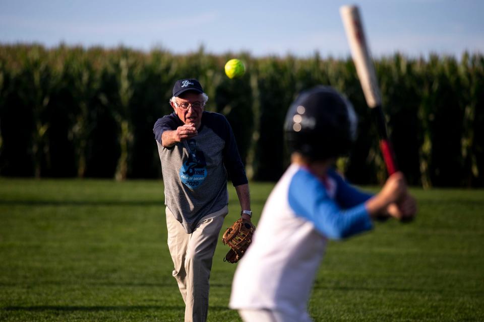U.S. Sen. Bernie Sanders, I-Vt., pitches to his grandson Dylan before a softball game hosted by the Senator at the Field of Dreams on Monday, Aug. 19, 2019, in Dyersville, Iowa.