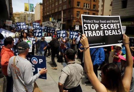 A group of demonstrators protesting the Trans-Pacific Partnership gather at the Federal Building in San Francisco, California June 9, 2015. REUTERS/Robert Galbraith