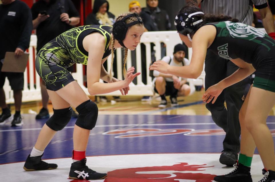 Ventura's Lily Jade Sinclair (left) faces off against Pacifica's Briceda Trejo during the Channel League wrestling championships on Saturday at San Marcos High. Sinclair won the 107-pound title.