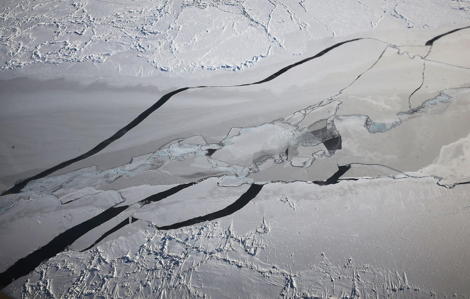 <p>Ice floats near the coast of West Antarctica as seen from a window of a NASA Operation IceBridge airplane during a mission to observe sea ice on Oct. 27, 2016 in-flight over Antarctica. NASA’s Operation IceBridge has been studying how polar ice has evolved over the past eight years and is currently flying a set of 12-hour research flights over West Antarctica at the start of the melt season. Researchers have used the IceBridge data to observe that the West Antarctic Ice Sheet may be in a state of irreversible decline directly contributing to rising sea levels. NASA and University of California, Irvine (UCI) researchers have recently detected the speediest ongoing Western Antarctica glacial retreat rates ever observed. (Photo: Mario Tama/Getty Images) </p>