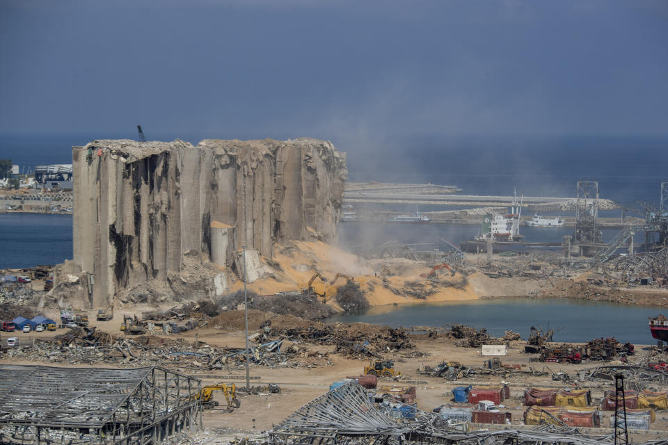 Rescue teams search for missing people at the site of the Aug. 4 explosion that killed more than 170 people, injured thousands and caused widespread destruction, in Beirut, Lebanon, Friday, Aug. 14, 2020. (AP Photo/Hassan Ammar)