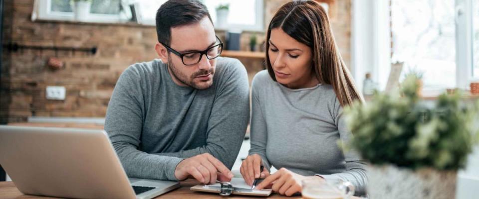 Couple doing finances at home.