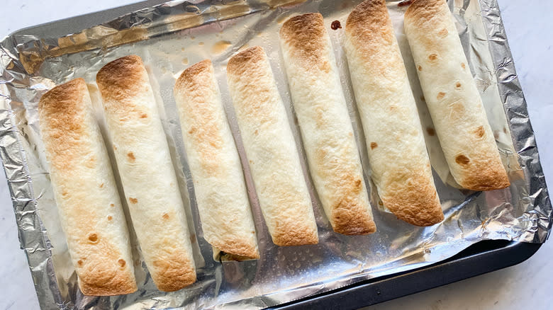 taquitos in foil-lined pan