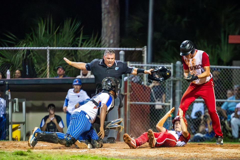 Vero Beach's Jackson Rahal (8) is called safe at home in a high school baseball Region 3-7A final against Harmony Monday, May 13, 2024, at Vero Beach High School.