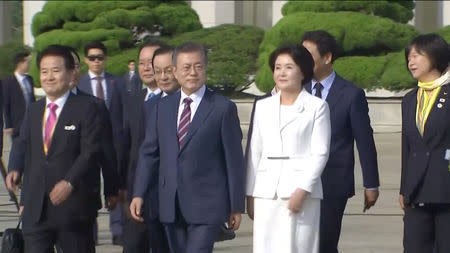 South Korean President Moon Jae-in and First Lady Kim Jung-sook before departing Seoul Airbase for Pyongyang to hold the third summit with North Korean leader Kim Jong Un in this still frame taken from video September 18, 2018. KBS/via REUTERS TV