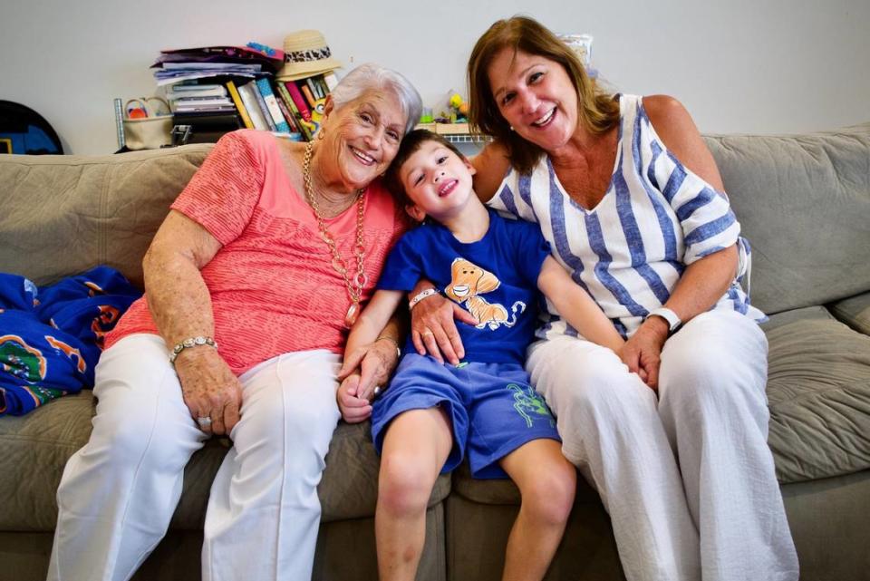 Elena Chavez, left, and Elena Blasser with their great grandson/grandson, John Rodriguez. Elena Chavez, 87, and her daughter, Elena Blasser, 64, died in the condo collapse of Champlain Towers South in Surfside.