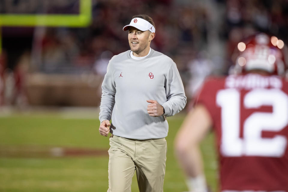 Oklahoma Sooners head coach Lincoln Riley smiles as he watches warmups during the Big 12 college football game between the Oklahoma Sooners and the TCU Horned Frogs on November 23, 2019, at Gaylord Family Oklahoma Memorial Stadium in Norman, OK.