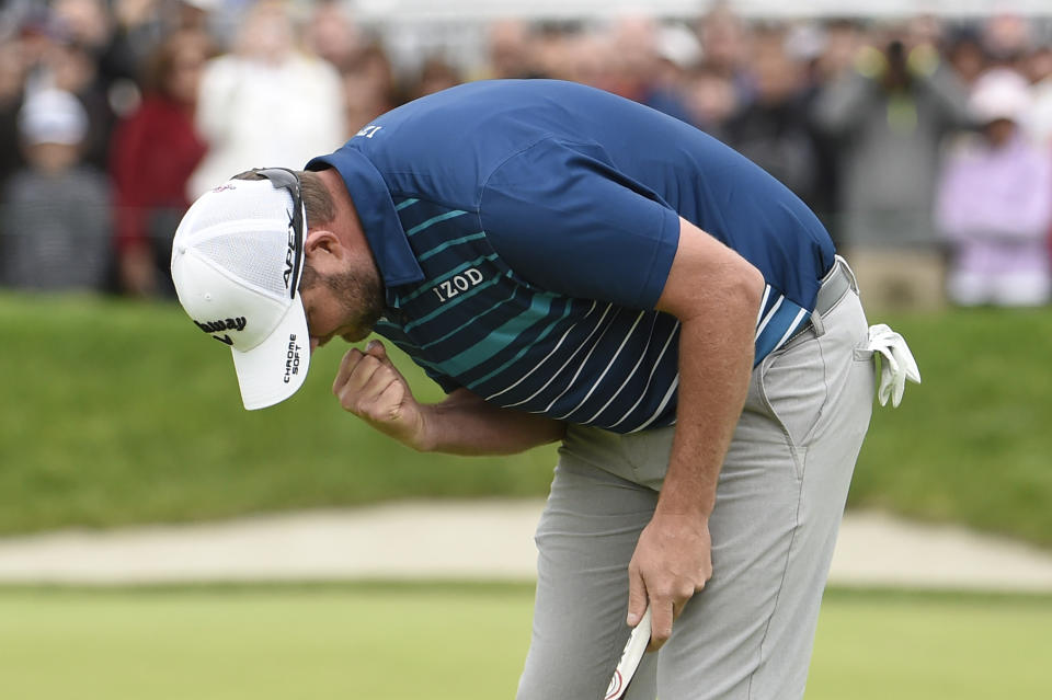 Marc Leishman, of Australia, pumps his fist on the 18th hole after winning the Farmer's Insurance Open at the Torrey Pines Golf Course, Sunday Jan. 26, 2020, in San Diego. (AP Photo/Denis Poroy)