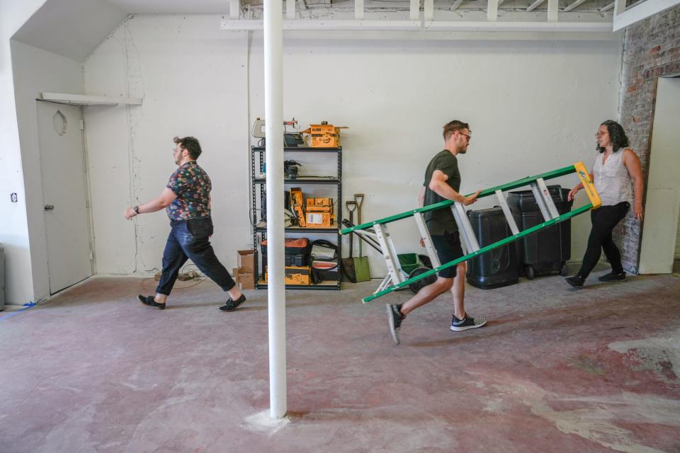 PVD Things founder Dillon Fagan and steering committee members Louis Langer and Sarah Summers set up shop at their new building in Providence. In addition to tools, the co-op plans to rent games, camping gear and more.