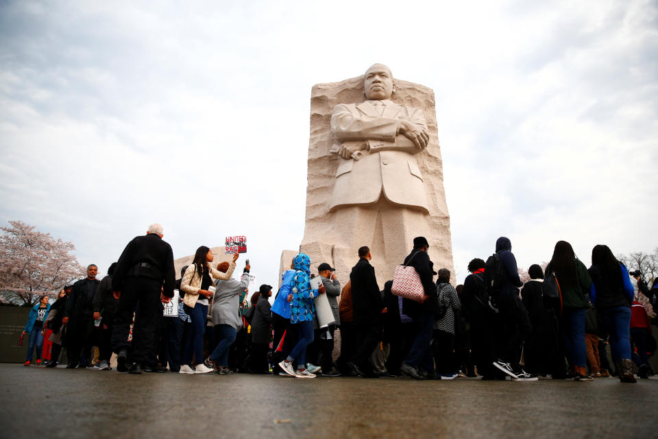 <p>Attendees are seen during a silent march and rally on the National Mall to mark the 50th anniversary of the assassination of civil rights leader Rev. Martin Luther King Jr. in Washington, April 4, 2018. (Photo: Eric Thayer/Reuters) </p>