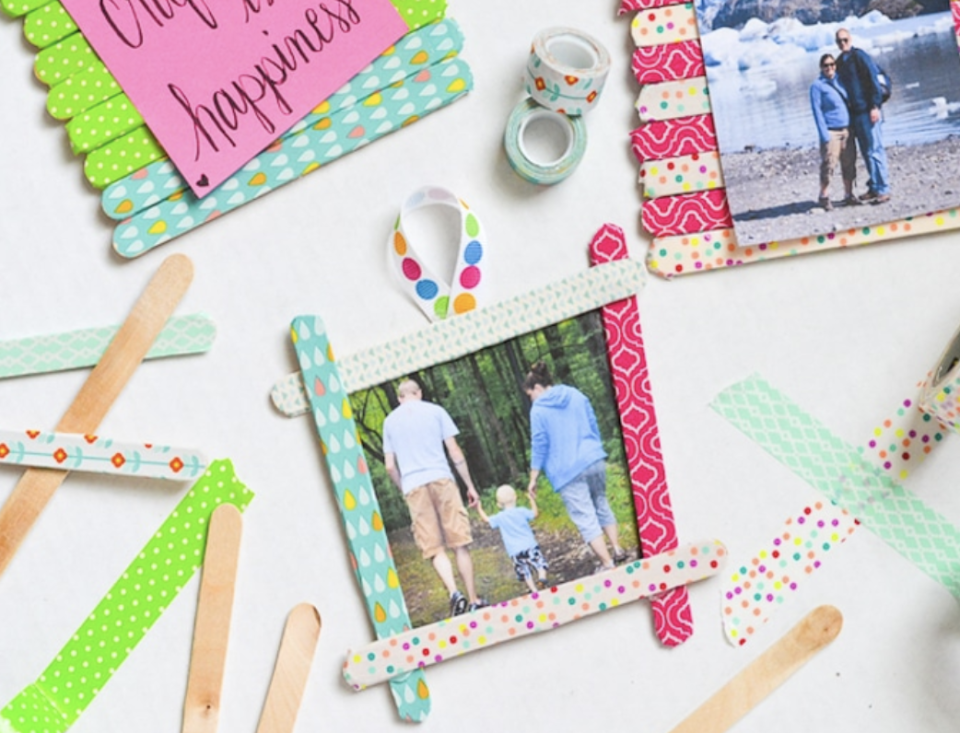 father's day crafts, family photo framed in a washi tape stick frame made of craft sticks