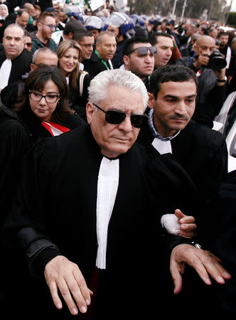 Mustapha Bouchachi, a rights activist and lawyer, marches with others during a protest to demand the immediate resignation of President Abdelaziz Bouteflika, in Algiers, Algeria March 23, 2019. REUTERS/Ramzi Boudina