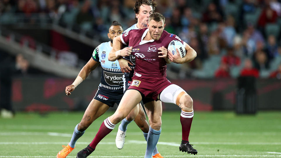 Seen here, Maroons centre Kurt Capewell is tackled in State of Origin Game I. 