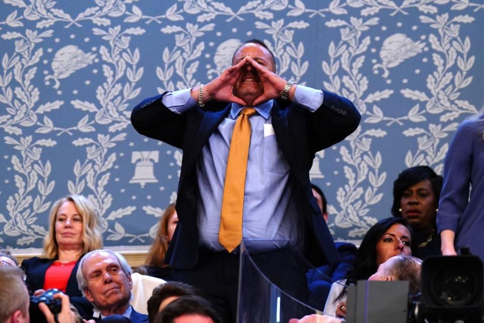 A protester shouts at President Joe Biden during the 2024 State of the Union