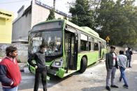 NEW DELHI, INDIA - JANUARY 26: A damaged DTC bus at ITO during the farmers' tractor rally on Republic Day, on January 26, 2021 in New Delhi, India. Major scenes of chaos and mayhem at Delhi borders as groups of farmers allegedly broke barricades and police check posts and entered the national capital before permitted timings. Police used tear gas at Delhi's Mukarba Chowk to bring the groups under control. Clashes were also reported at ITO, Akshardham. Several rounds of talks between the government and protesting farmers have failed to resolve the impasse over the three farm laws. The kisan bodies, which have been protesting in the national capital for almost two months, demanding the repeal of three contentious farm laws have remained firm on their decision to hold a tractor rally on the occasion of Republic Day.(Photo by Sanjeev Verma/Hindustan Times via Getty Images)