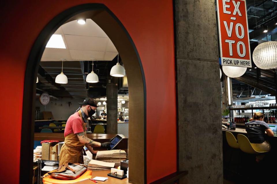 Marshall Davis works at Ex-Voto Cocina Nixtamal located in the Durham Food Hall on Thursday, Aug. 20, 2020. The restaurant has shifted to Burrito Bodega as a temporary takeout pop-up during the pandemic.