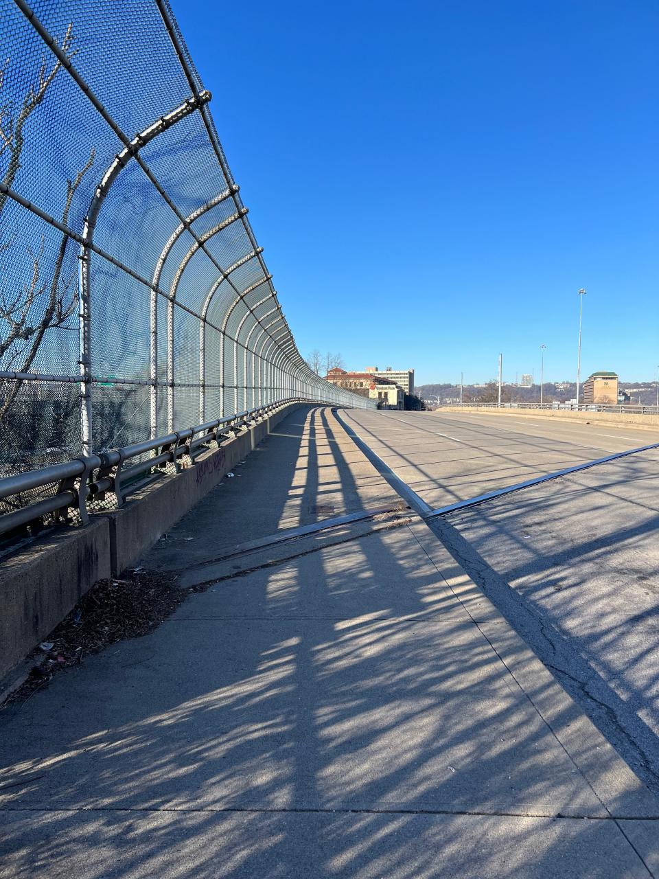 A 10-foot sidewalk on Seventh Street from downtown to Queensgate lacks any barrier between walkers and four lanes of traffic. All of the sidewalks in Bridge Forward's proposed grid are strewn with White Castle wrappers, liquor bottles and crumbling concrete.