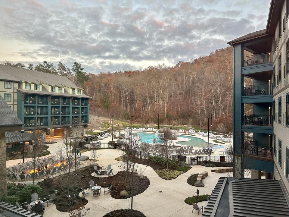 View from the authro's room of the hotel's pools, fire pits, and surrounding trees