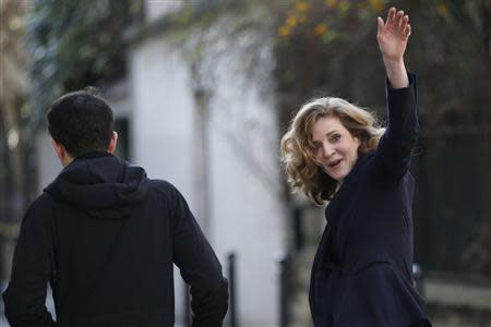 Nathalie Kosciusko-Morizet (R), conservative UMP political party candidate for the mayoral election, waves as she leaves after casting her ballot at a polling station in Paris March 23, 2014. REUTERS/Gonzalo Fuentes