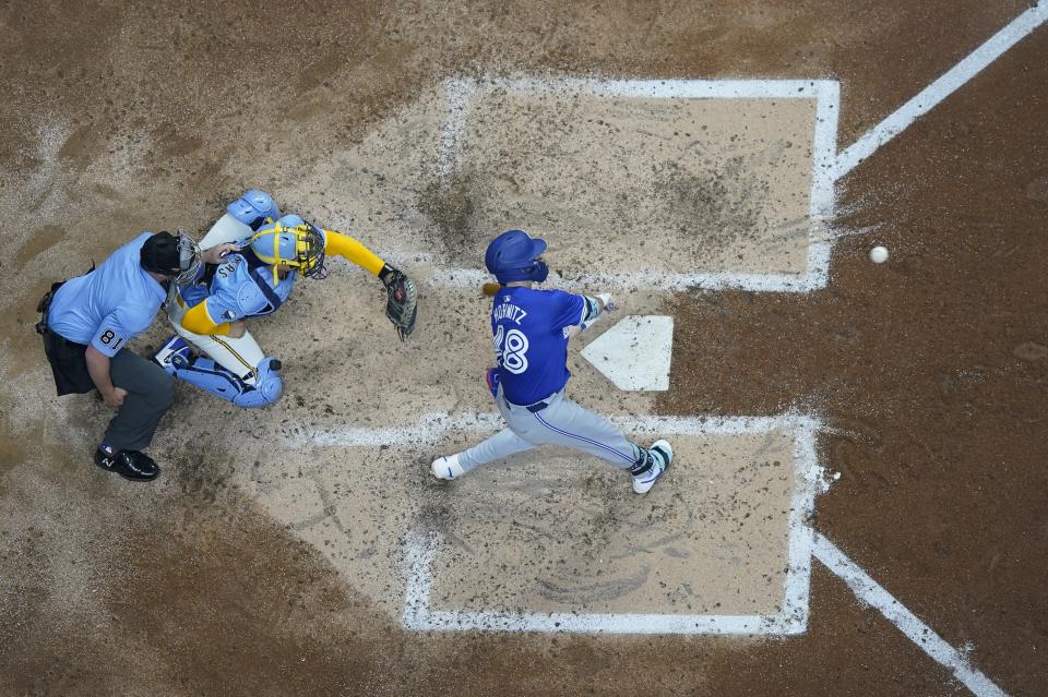 Toronto Blue Jays' Spencer Horwitz hits an RBI single during the fourth inning of a baseball game against the Milwaukee Brewers Tuesday, June 11, 2024, in Milwaukee. (AP Photo/Morry Gash)