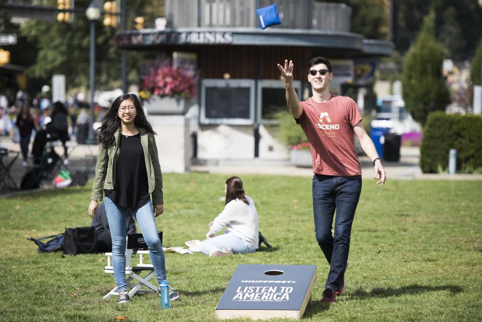 &nbsp;Andrew Kitahara and Kuai-Kuai Jin play a game of cornhole.