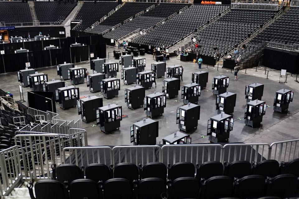 Voting machines fill the floor for early voting at the State Farm Arena in Atlanta.