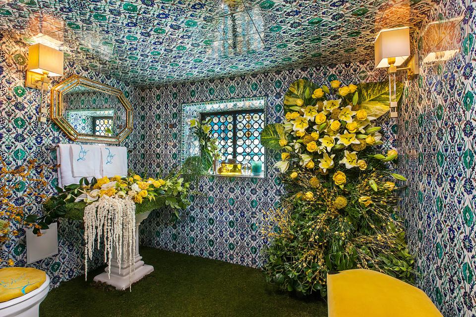 A tiled powder room decorated by Lashee Floral.