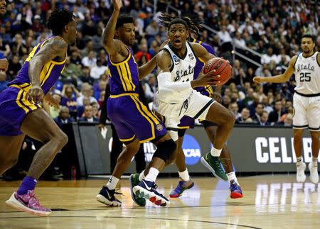 Mar 29, 2019; Washington, DC, USA; Michigan State Spartans forward Aaron Henry (11) drives to the basket against LSU Tigers guard Marlon Taylor (14) during the first half in the semifinals of the east regional of the 2019 NCAA Tournament at Capital One Arena. Mandatory Credit: Amber Searls-USA TODAY Sports