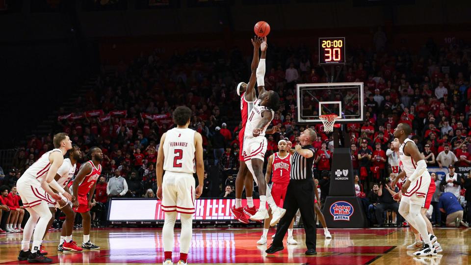Mar 10, 2024; Piscataway, New Jersey, USA; Rutgers Scarlet Knights center Clifford Omoruyi (11) tips off against Ohio State Buckeyes forward Kalen Etzler (24) to start the game at Jersey Mike's Arena. Mandatory Credit: Vincent Carchietta-USA TODAY Sports